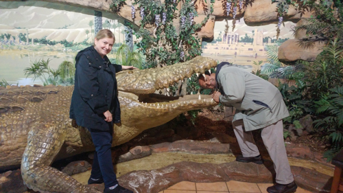 Mary and S. T. with his head in a crocodile's mouth