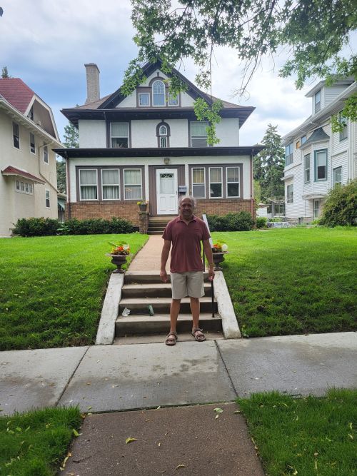 Photo of S. T. in front of Donald Wandrei's house