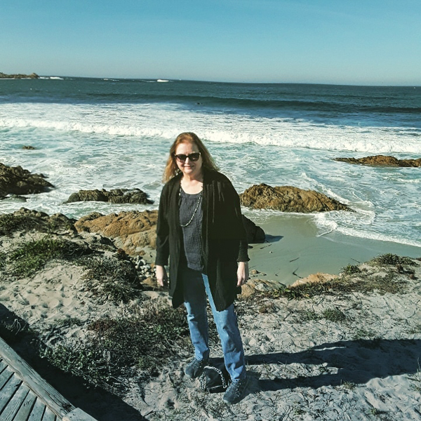 Photo of Mary Wilson on the California seashore.