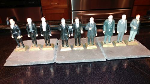 Nine porcelain figures of U. S. presidents.